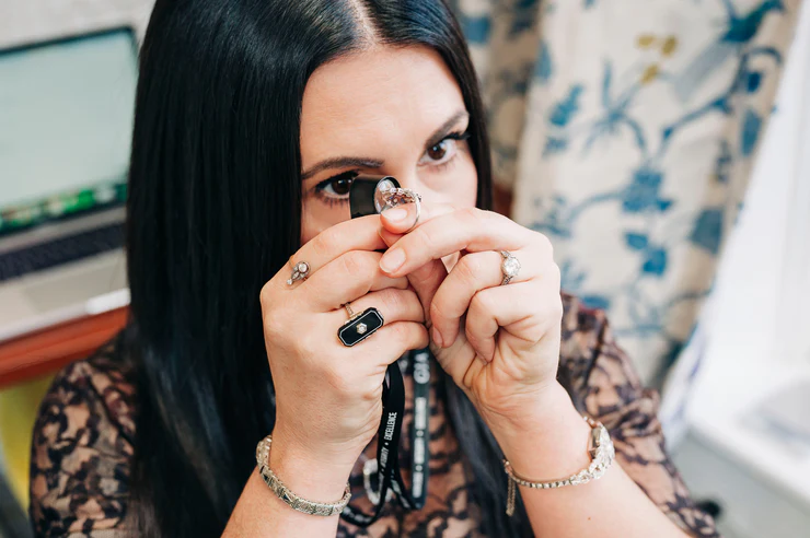 Professional jewelry authentication and restoration Close-up of jewelry authentication and inspection process